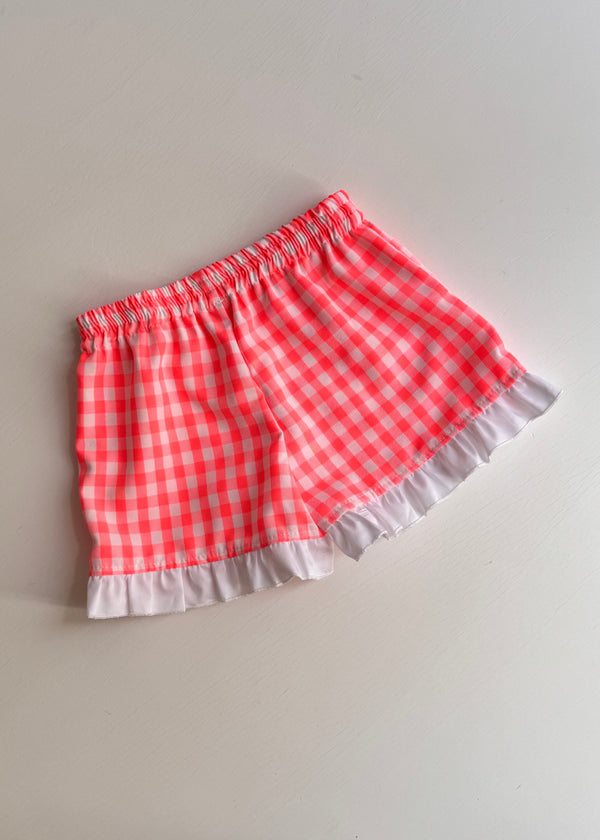 Pantaloni scurti cu carouri roz neon si volane