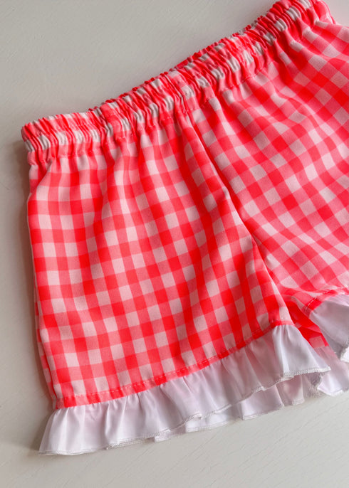 Pantaloni scurti cu carouri roz neon si volane